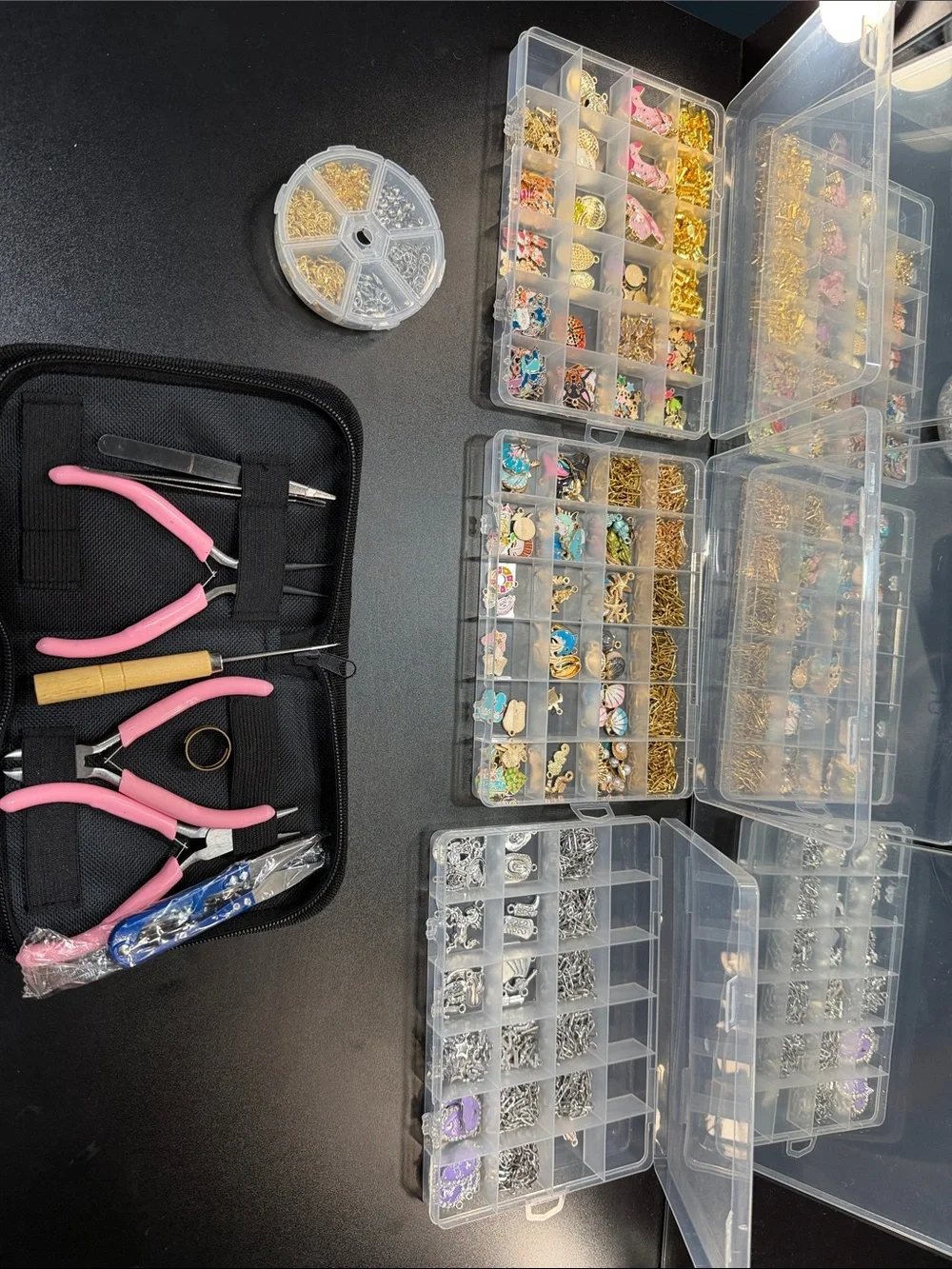 Charm necklace and bracelet making kit. Everything in the picture is included.